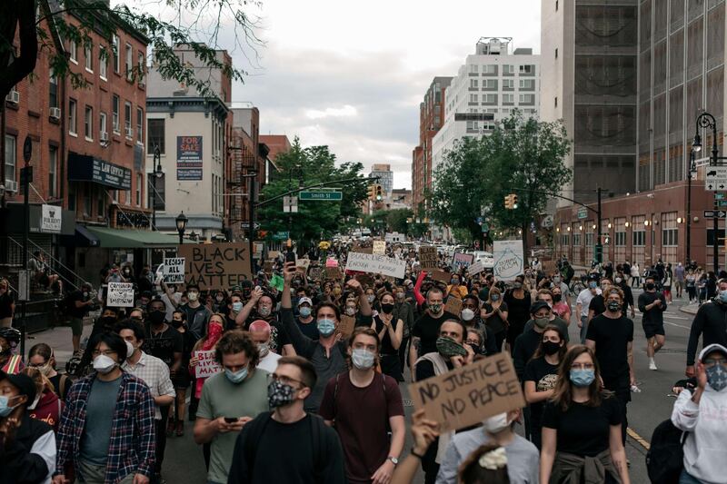 NEW YORK, NY - JUNE 02: Protesters denouncing police brutality and systemic racism march in the street in the Brooklyn borough of New York City. Days of protest, sometimes violent, have followed in many cities across the country in response to the death of George Floyd while in police custody in Minneapolis, Minnesota on May 25th.   Scott Heins/Getty Images/AFP
== FOR NEWSPAPERS, INTERNET, TELCOS & TELEVISION USE ONLY ==
