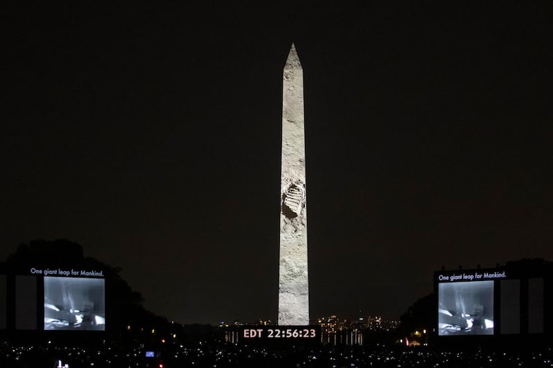 Neil Armstrong's first foot print on the Moon is seen as the Apollo 11 launch and Moon landing is projected onto the Washington Monument and additional screens on the National Mall by in Washington, DC, US. EPA