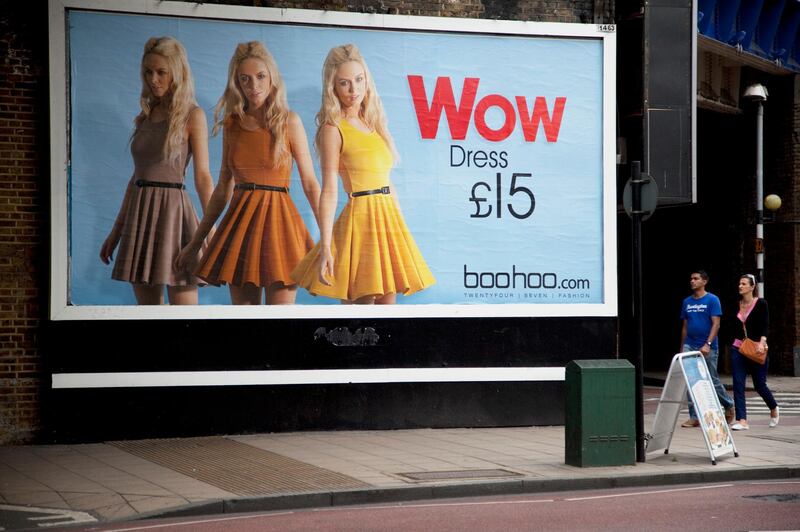 Advertising poster promotes an inexpensive dress for just Â£15 through Boohoo.com. In times of austrerity and economic downturn cheap goods are more than welcome and affordable. London. (Photo by In Pictures Ltd./Corbis via Getty Images)