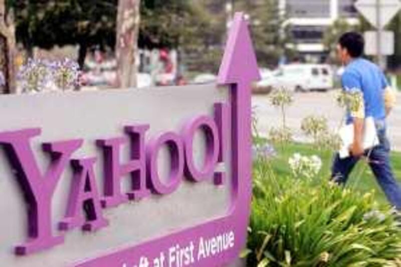 A worker walks into Yahoo headquarters in Sunnyvale, Calif., Wednesday, July 29, 2009. Yahoo Inc. invested billions of dollars in its Internet search engine during the past six years before realizing it made more sense to entrust the job to an outsider _ something the company's co-founders concluded shortly after they started a Web directory in the mid-1990s. This week's deal with Microsoft closes another chapter in an influential Web pioneer that has seen many of them. (AP Photo/Paul Sakuima)