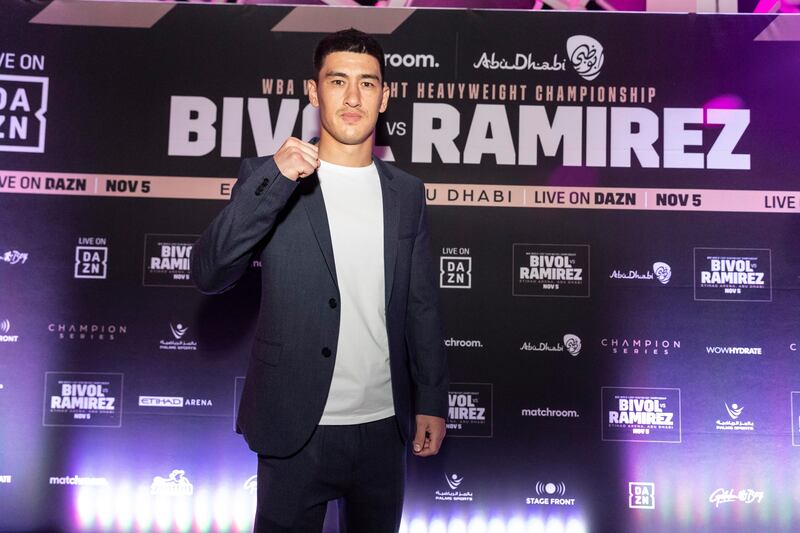 Dimitry Bivol poses for photos after arriving for the launch party.