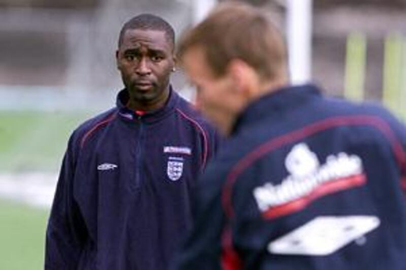 Andrew Cole, left, watches Teddy Sheringham during an England training session. The pair, who were Manchester United teammates, never got along.