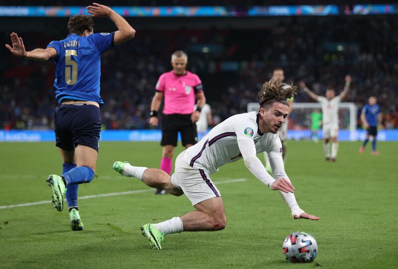 Italy midfielder Manuel Locatelli fights for the ball with England midfielder Jack Grealish during the final of Euro 2020. AFP