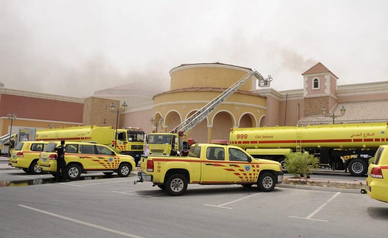 Firefighters attempt to extinguish a fire at the Villagio Mall, in Doha on May 28, 2012. The Qatar-based satellite network Al Jazeera said 19 people were killed, including 13 children. Reuters 