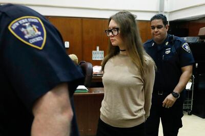 Anna Sorokin is escorted by court officers as she returns to court after a lunch recess in her trial in New York State Supreme Court, Wednesday, March 27, 2019, in New York. Sorokin, who claimed to be a German heiress, is on trial on grand larceny and theft of services charges.  (AP Photo/Richard Drew)