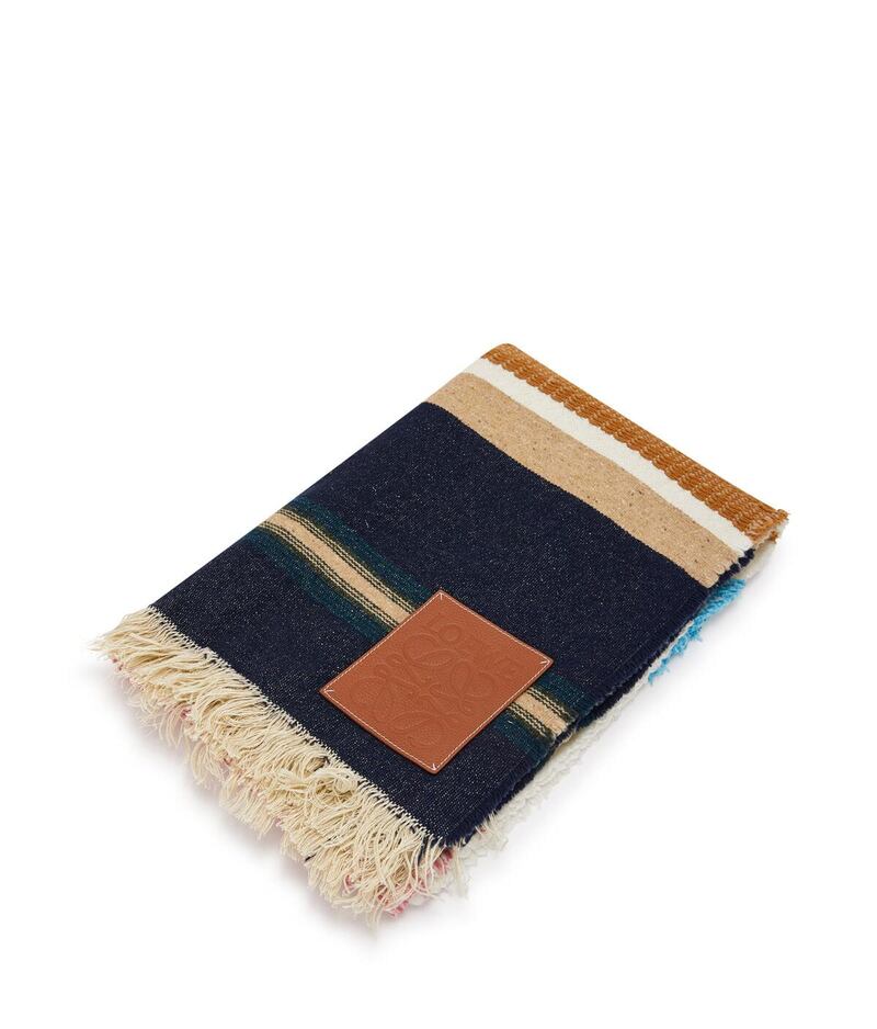 Loewe presents a striped and fringed blanket, with leather patch. Courtesy Loewe