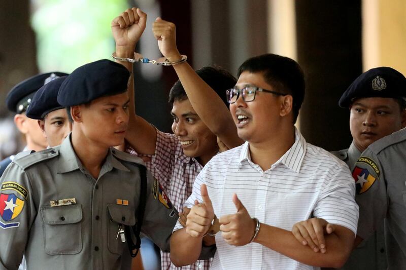 FILE PHOTO: Detained Reuters journalist Wa Lone and Kyaw Soe Oo arrive at Insein court in Yangon, Myanmar August 27, 2018. REUTERS/Ann Wang/File Photo