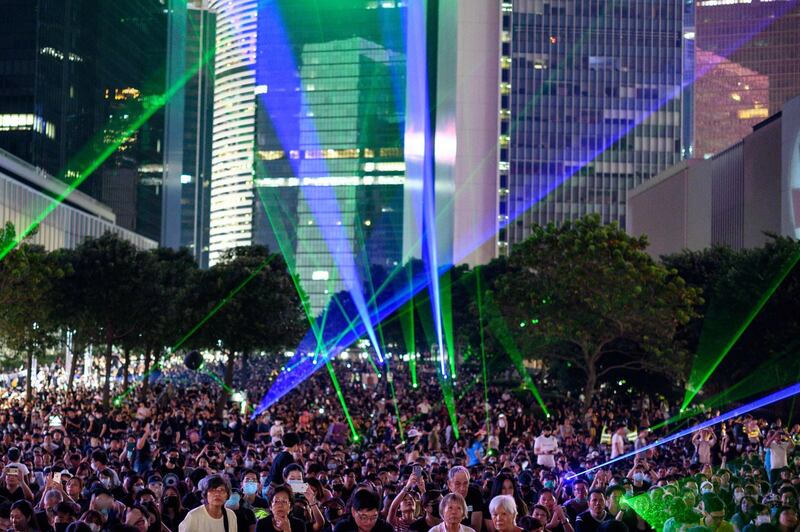 People attend a rally to mark the fifth anniversary of the "Umbrella Movement", in the Admiralty area of Hong Kong on September 28, 2019. Thousands of Hong Kongers gathered on September 28 to mark the fifth anniversary of the 'Umbrella Movement', the failed pro-democracy campaign that laid the groundwork for the massive protests currently engulfing the city.  / AFP / Philip FONG
