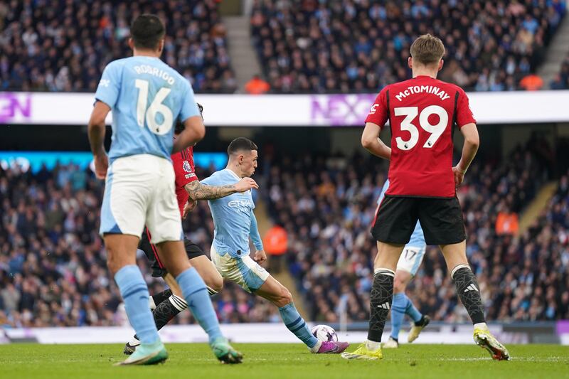 Manchester City's Phil Foden scores their first goal. PA 