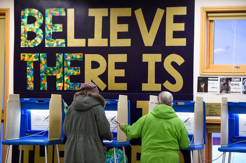 Voters cast their ballots at a polling location inside an elementary school in Minneapolis, Minnesota. EPA