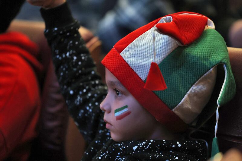 A young fan cheers on his team. AFP