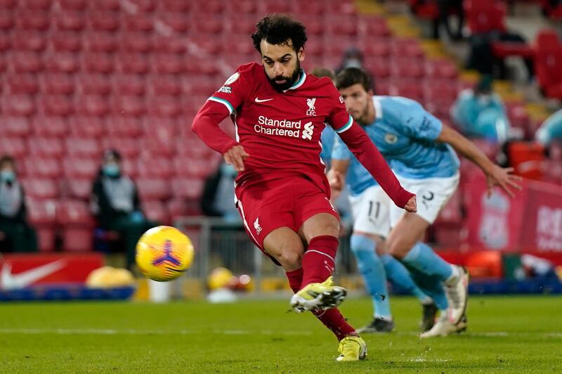 Liverpool's Mohamed Salah scores from the spot. AFP