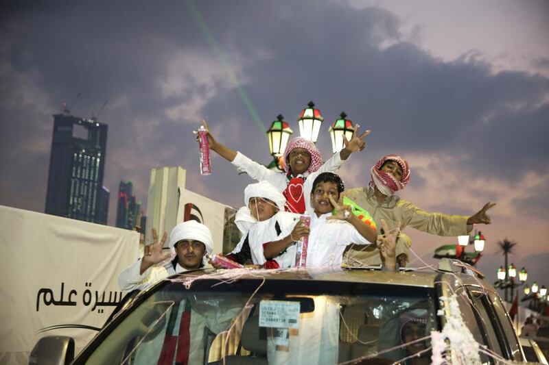 The Corniche was abuzz last night with people celebrating National Day. Silvia Razgova / The National