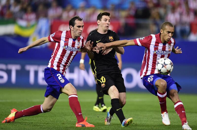 One reason for Atletico Madrid’s recent success over Barcelona will be their handling of the star striker Lionel Messi, centre. Javier Soriano / AFP