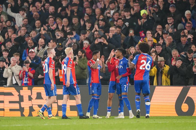 Michael Olise celebrates with teammates after scoring Crystal Palace's fourth goal, and his second, against Manchester United. PA