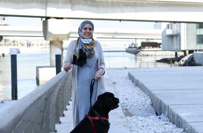 Abu Dhabi, United Arab Emirates - Yasmeen El Mallah outside her residence  with her dog Pablo, who is 4 years old, and was adopted from Egypt.  She enjoys living on Al Reem Island, and has been residing there for the past 6 years. Khushnum Bhandari for The National
