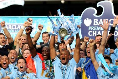 MANCHESTER, ENGLAND - MAY 13: Vincent Kompany the captain of Manchester City lifts the trophy following the Barclays Premier League match between Manchester City and Queens Park Rangers at the Etihad Stadium on May 13, 2012 in Manchester, England. (Photo by Alex Livesey/Getty Images)