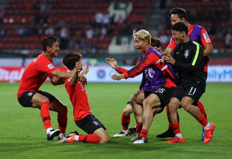 DUBAI, UNITED ARAB EMIRATES - JANUARY 22:  Kim Jin-Su of South Korea (2L) celebrates as he scores his team's second goal with team mates during the AFC Asian Cup round of 16 match between South Korea and Bahrain at Rashid Stadium on January 22, 2019 in Dubai, United Arab Emirates. (Photo by Francois Nel/Getty Images)