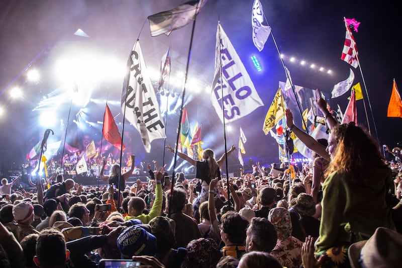 Festival goers watch Sir Paul McCartney perform at Glastonbury Festival. AP Photo