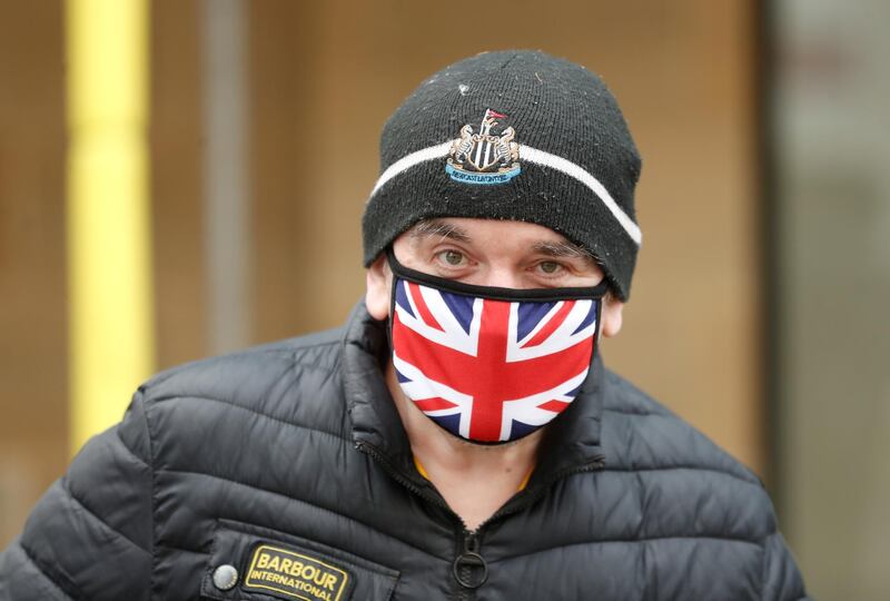 A man wears a protective face mask in Newcastle upon Tyne. Reuters