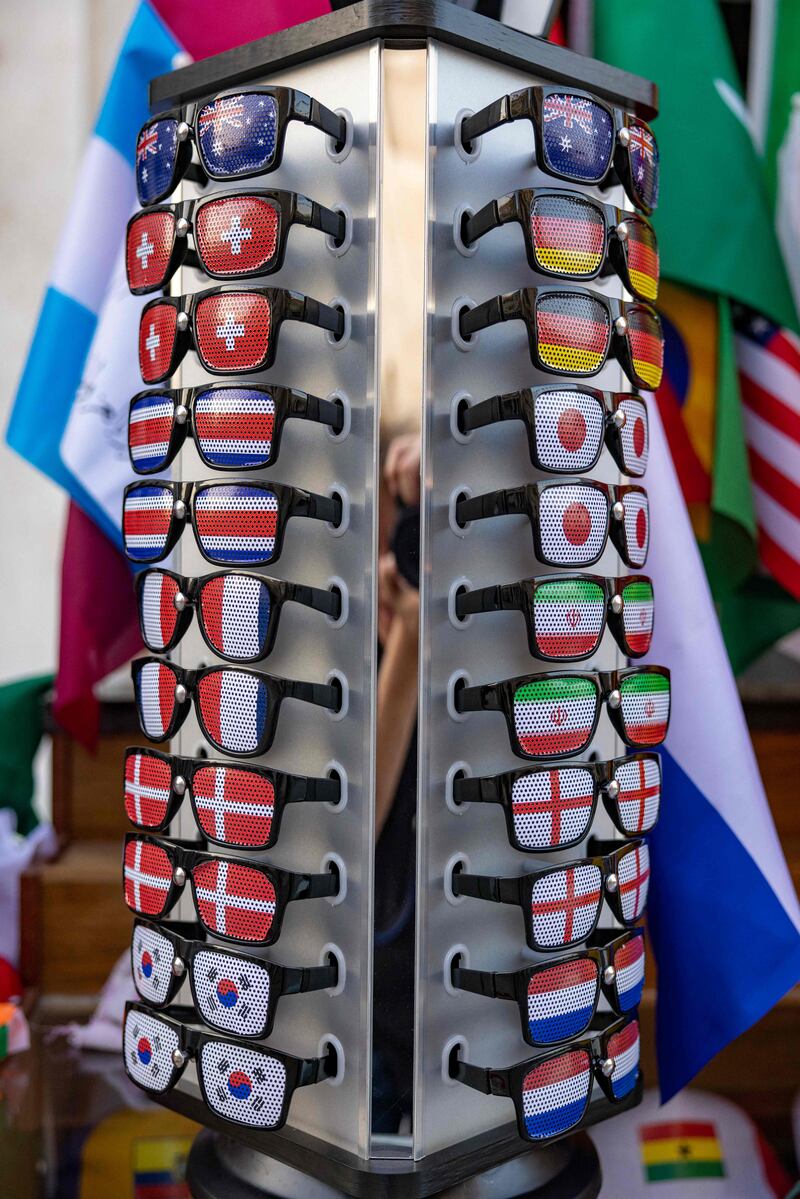 Sunglasses with some of the FIFA participant countries' colours painted on them are kept on a display for sale in Doha  ahead of the Qatar 2022 FIFA World Cup football tournament. AFP