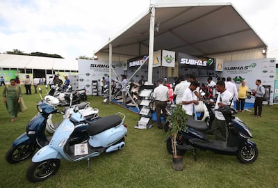 Visitors inspect an exhibition stall during the EV Expo and Green Energy Summit 2022 in Bengaluru, India, in July.  EPA