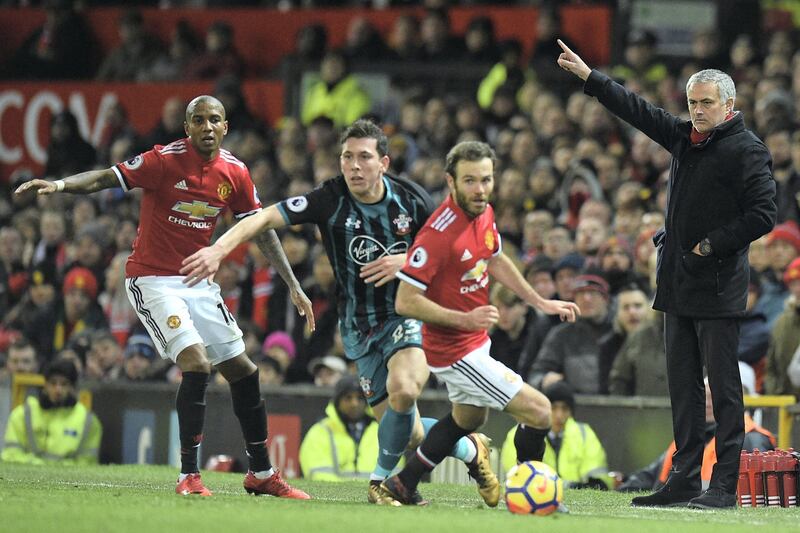 Manchester United's Portuguese manager Jose Mourinho (R) gestures on the touchline during the English Premier League football match between Manchester United and Southampton at Old Trafford in Manchester, north west England, on December 30, 2017. / AFP PHOTO / Oli SCARFF / RESTRICTED TO EDITORIAL USE. No use with unauthorized audio, video, data, fixture lists, club/league logos or 'live' services. Online in-match use limited to 75 images, no video emulation. No use in betting, games or single club/league/player publications.  / 