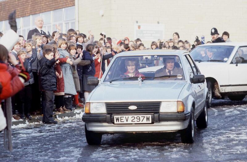 TETBURY, UNITED KINGDOM - DECEMBER 08:  Princess Diana Driving Her Ford Escort Car On  A Visit To St Mary's School In  Tetbury. In The Passenger Seat Is Her Police Bodyguard Graham Smith  (Photo by Tim Graham Photo Library via Getty Images)