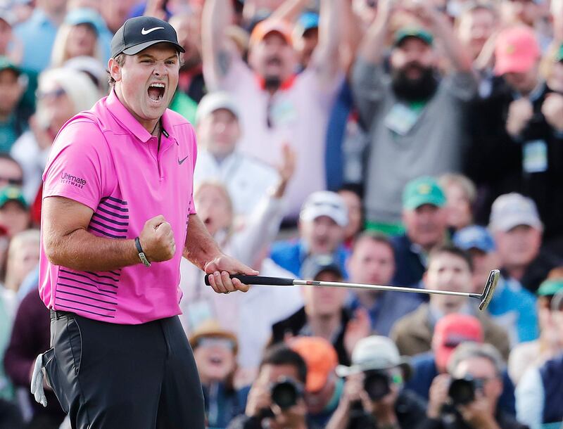 epaselect epa06656188 Patrick Reed of the US celebrates after sinking his par putt on the eighteenth hole to win the 2018 Masters Tournament at the Augusta National Golf Club in Augusta, Georgia, USA, 08 April 2018. The 2018 Masters Tournament is held 05 April through 08 April 2018.  EPA/ERIK S. LESSER