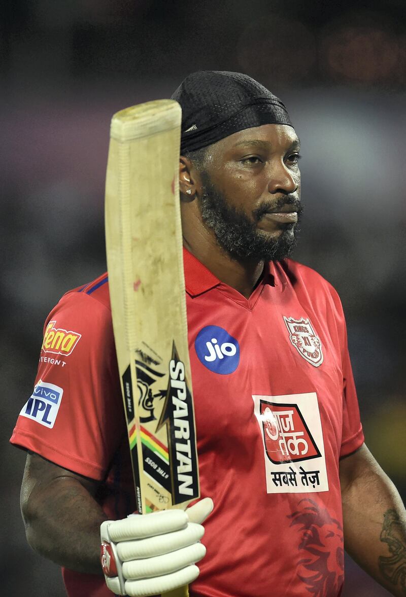 Kings XI Punjab Chris Gayle walks back to the pavillion after he was dismissed by Rajasthan Royals Ben stokes during the 2019 Indian Premier League (IPL) Twenty20 cricket match between Rajasthan Royals and Kings XI Punjab at the Sawai Mansingh stadium in Jaipur on March 25, 2019. (Photo by Money SHARMA / AFP) / ----IMAGE RESTRICTED TO EDITORIAL USE - STRICTLY NO COMMERCIAL USE-----