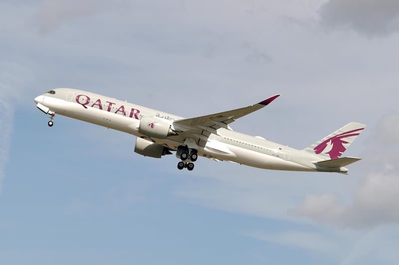 This picture taken on September 27, 2019 shows an Airbus A350 of Qatar Airways company  after taking off from the Toulouse-Blagnac airport, near Toulouse. (Photo by PASCAL PAVANI / AFP)