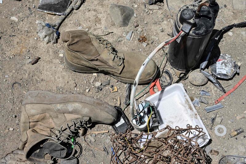 Used boots and other items at a junkyard near the Bagram Air Base. AFP