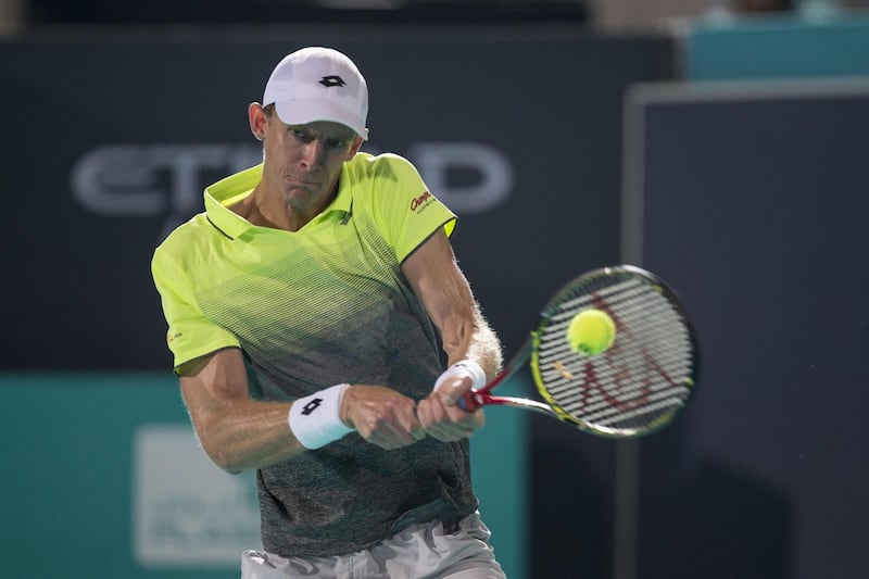 South Africa’s Kevin Anderson returns the ball to Spain's Pablo Carreno Busta during the Mubadala World Tennis Championship 2017 match in Abu Dhabi, on December 28, 2017. / AFP PHOTO / NEZAR BALOUT