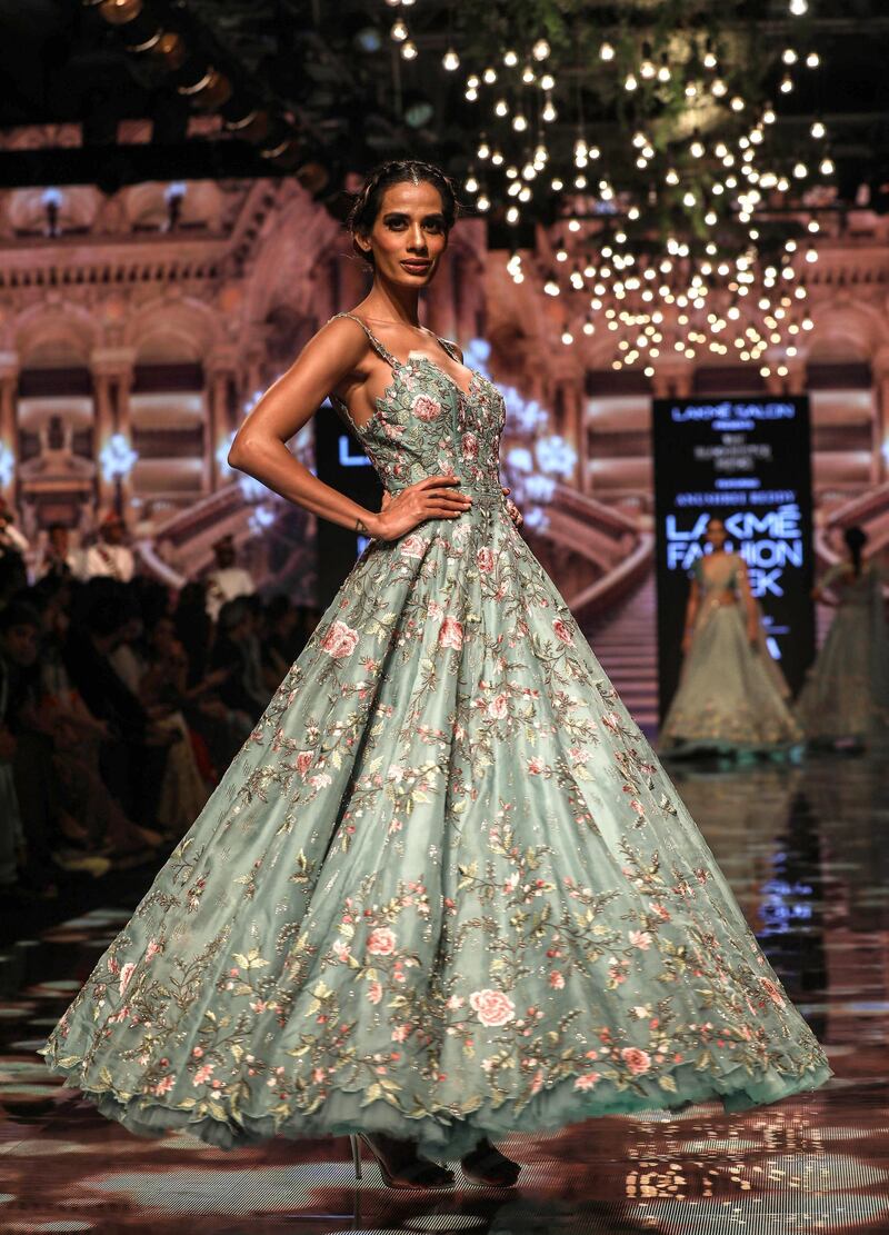 epa07790096 A model presents a creation by Indian designer Anushree Reddy during the Lakme Fashion Week (LFW) Winter/Festive 2019 in Mumbai, India, 24 August 2019. More than 75 designers are showcasing their collections at the event until 25 August.  EPA/DIVYAKANT SOLANKI