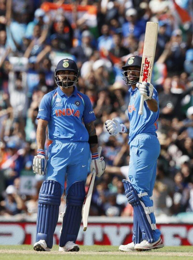 India's Shikhar Dhawan, right, celebrates his fifty alongside captain Virat Kohli during their Champions Trophy match against South Africa at The Oval, Sunday, June 11, 2017. AP Photo