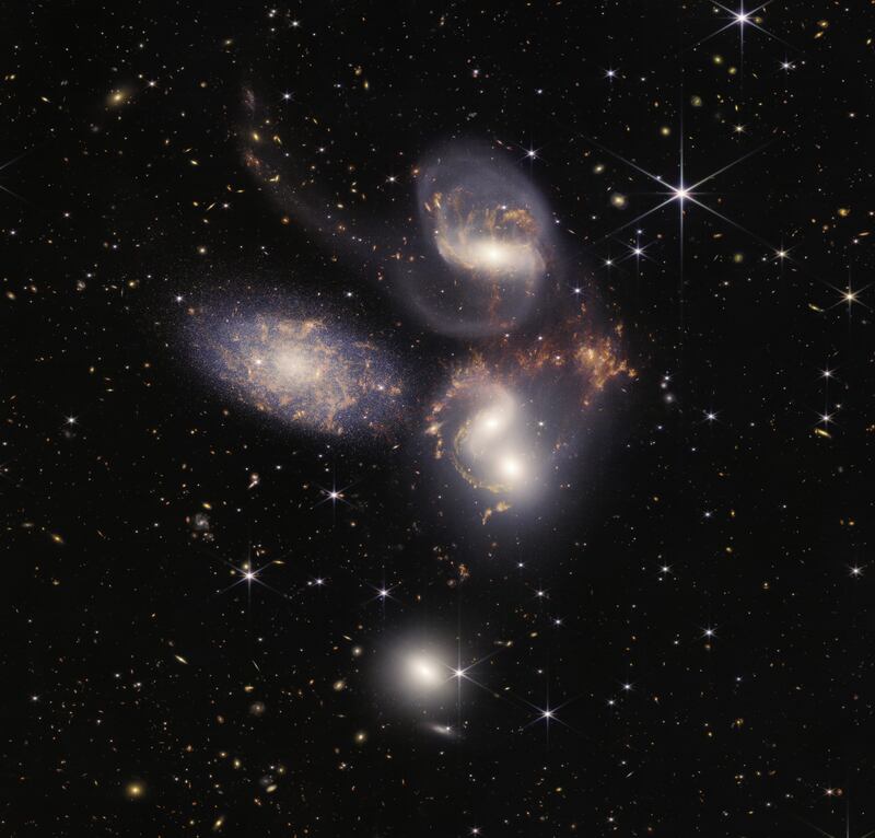 An image of Stephan's Quintet, an area in space with a group of five galaxies. 
