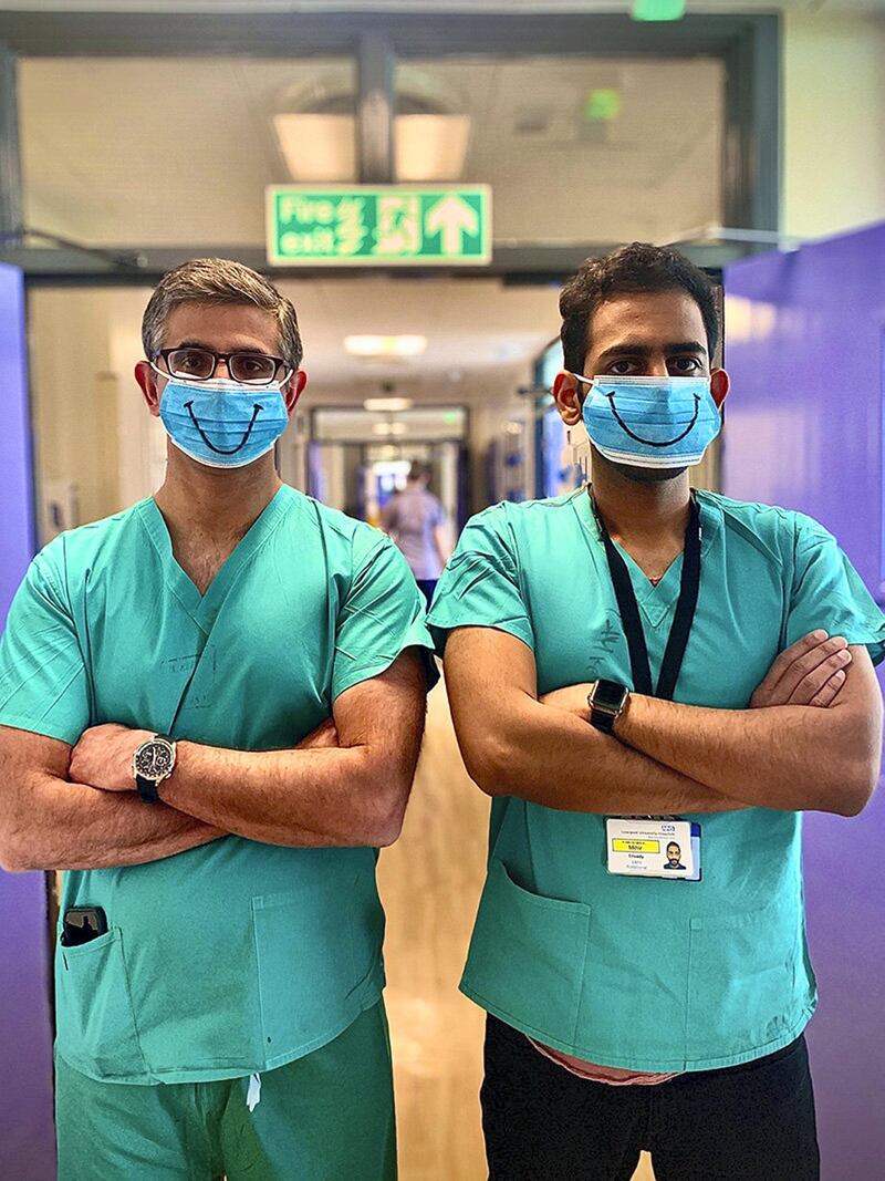 After a long week looking after patients, an Orthopaedic Consultant and his Surgical Trainee wanted to lift the mood of not only themselves, but their colleagues and patients on the ward. It's easy to forget how much we need our mouths to communicate and convey emotion, until there is a mask in front to prevent it. I took this picture to show that our NHS and our nation can still find light in the darkest of times. Keep smiling and be haPPE!

I was a final year student doctor at the time and had been drafted in to work for the NHS early. A new type of relationship was formed between senior doctors and students during the pandemic; I was considered ‘part of the team’. When I captured this moment, it was a breath of fresh air to experience some light-heartedness during such a difficult time. This photo brings back a mixture of emotions because a week after it was taken, I contracted COVID-19 myself. Since this was taken, I have graduated as a doctor and worked through a moment in history by IMOGEN JOHNSTON
