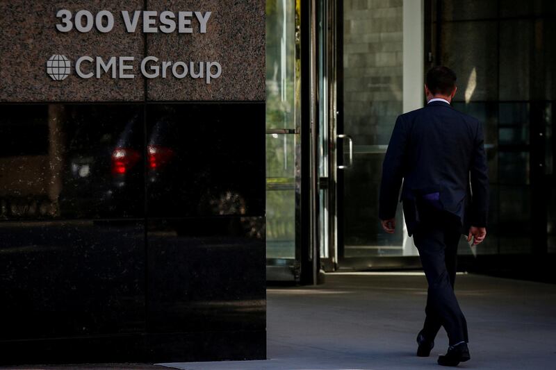 FILE PHOTO: A man enters the CME Group offices in New York, U.S., October 18, 2017. REUTERS/Brendan McDermid/File Photo