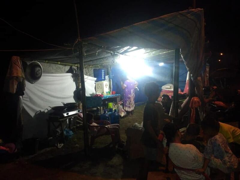 Displaced people gathering at a makeshift shelter in Anyer. EPA