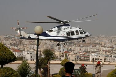 A helicopter carrying tourists, who were injured in a stabbing, lands at King Hussein Medical Center in Amman, Jordan. Reuters