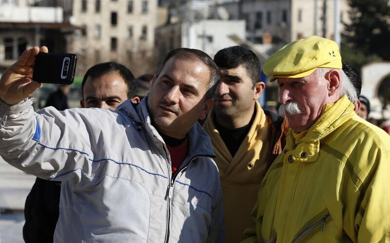 Zakkour poses for a selfie in Saadallah al-Jabiri square