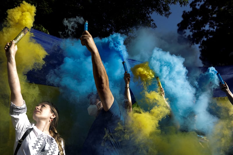 People in support of Ukraine hold an anti-war protest outside the Russian Embassy in Mexico City on February 28. Reuters
