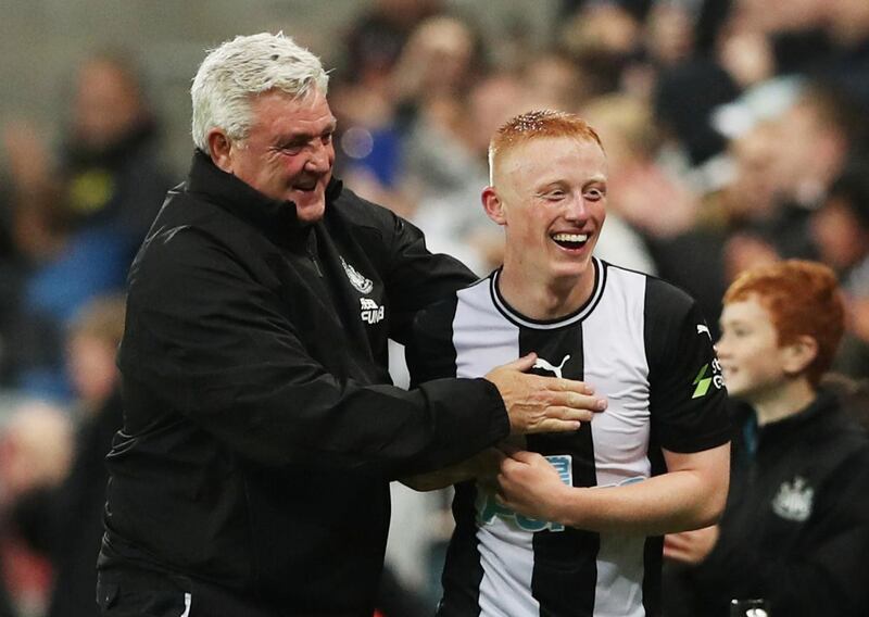 Matthew Longstaff celebrates with Newcastle manager Steve Bruce. Reuters