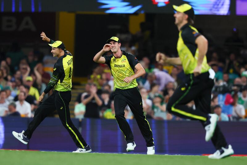 Australian players celebrate the dismissal of Ireland's Paul Stirling during the T20 World Cup Super 12 Group 1 match at The Gabba in Brisbane on October 31, 2022. AP 