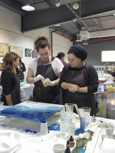 Artist Dina Khataan, right, conducted a workshop in Dubai to share her resin art knowledge with participants. ourtesy Dina Khataan