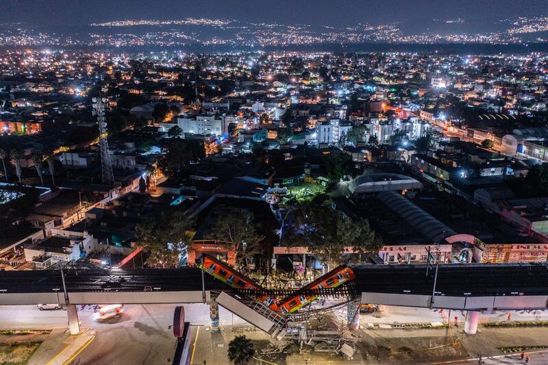 An aerial view of the scene after an elevated section of metro track in Mexico City, carrying train cars with passengers, collapsed onto a busy road, killing at least 20 people and injuring 70. Getty Images