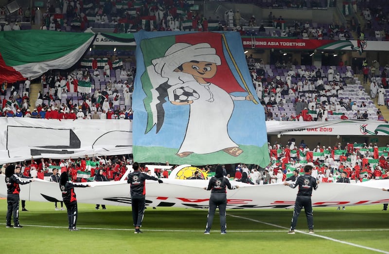 Al Ain, United Arab Emirates - January 14, 2019: Fans unveil a banner before the game between UAE and Thailand in the Asian Cup 2019. Monday, January 14th, 2019 at Hazza Bin Zayed Stadium, Al Ain. Chris Whiteoak/The National