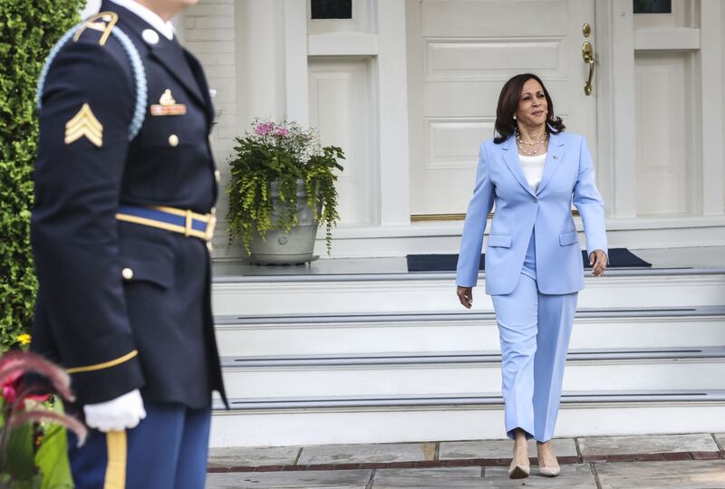 US Vice President Kamala Harris arrives to greet King Abdullah II of Jordan at the vice president's residence in Washington.