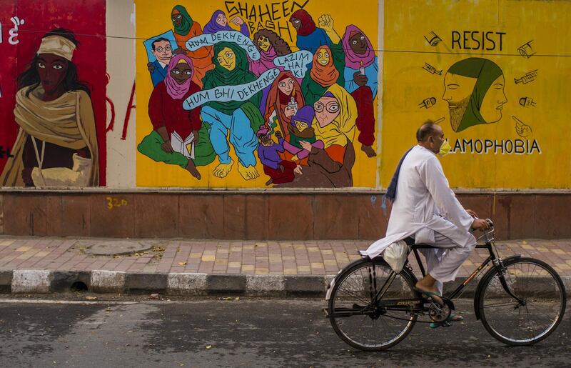 A man with a protective mask rides a moped on a deserted road, amid a nationwide lockdown to slow the spread of coronavirus, in New Delhi, India. Getty Images