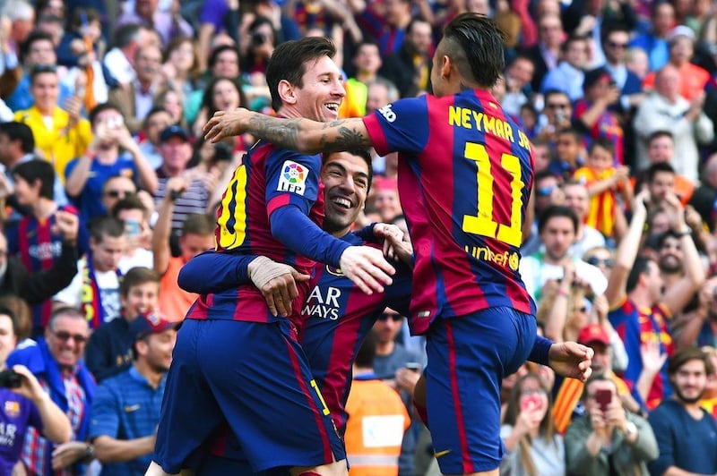Luis Suarez, centre, of Barcelona celebrates with teammates Lionel Messi, left, and Neymar during their Primera Liga match against Valencia at Camp Nou on April 18, 2015. Getty Images